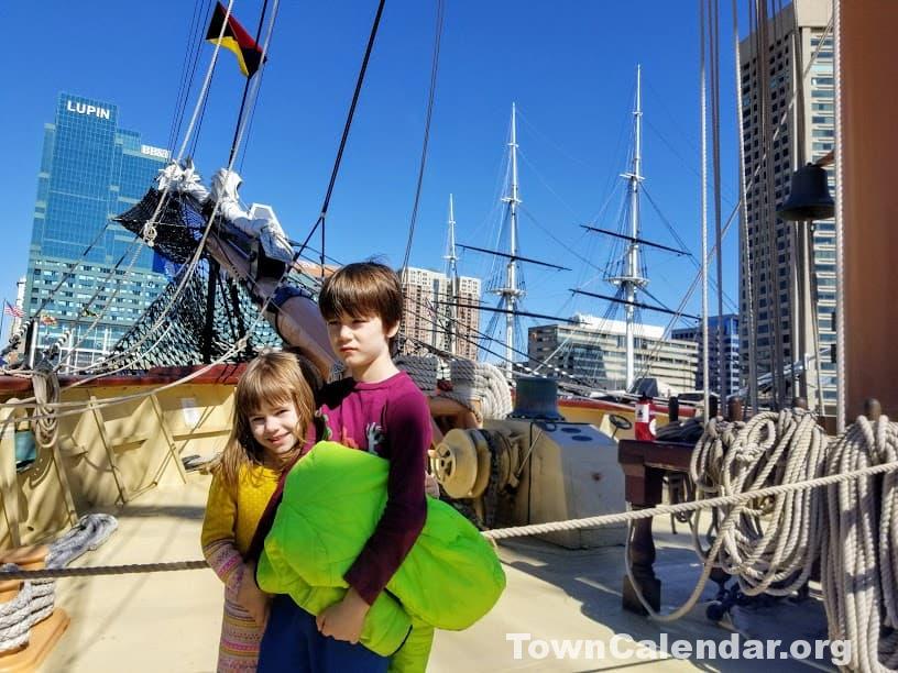 Baltimore is #1 on our list of the best road trips near Washington DC.  My kids on the Oliver Hazard Perry, a replica ship which was at that time on display in Baltimore Harbor.